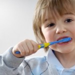 image of child brushing to prevent tooth decay